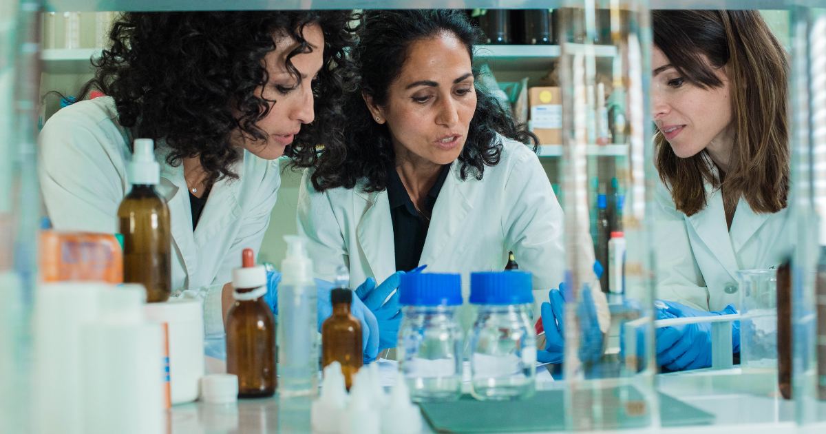 Laboratory technician managing sample intake under staffing pressure in a clinical laboratory